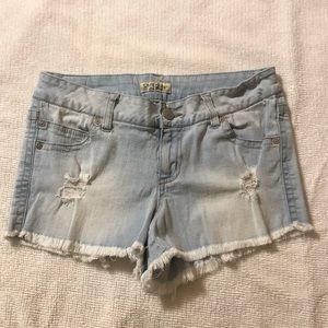 Distressed medium high waist ripped shorts